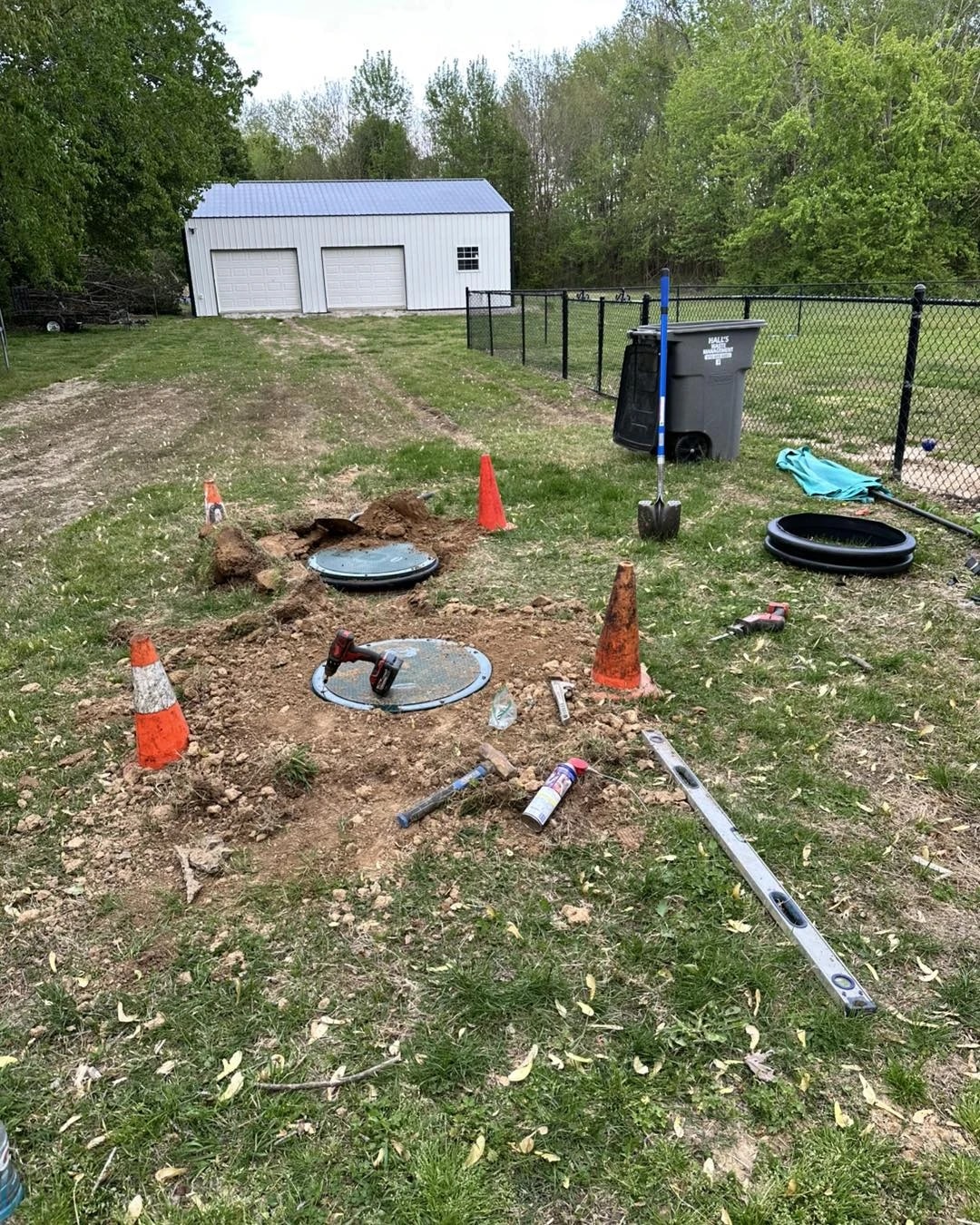 Wurth Brothers dual septic tank installation - professional setup of two septic tanks in residential garden, providing enhanced wastewater treatment capacity and system reliability
