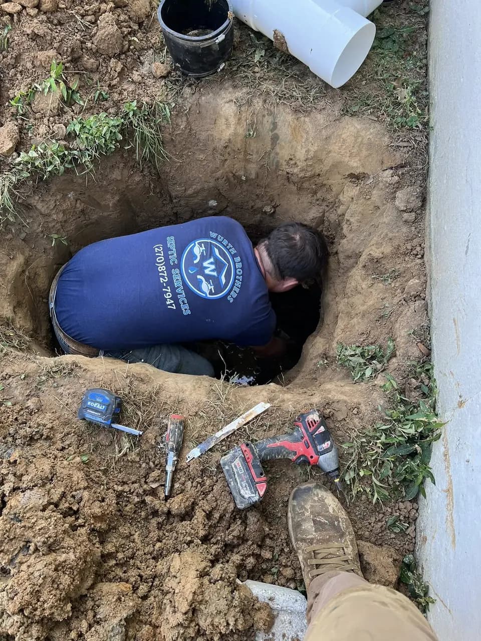 A Wurth Brothers repair in progress in an open hole on a job site.